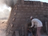 Stoking the brick oven