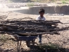 hard working child carrying wood to the fire stoker